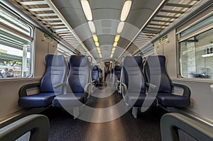 View of the interior of a train with empty seats