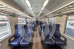 View of the interior of a train with empty seats