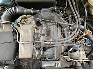 View of internal parts under the open hood of the car