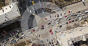 View of intersection of streets in Kiev with cars, taxis, bus and people from above in 4K