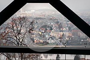 View through the iron girders, supports and struts of the oldest suspension railway in the world to the town in the haze at the