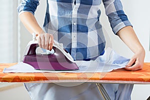 View of ironing woman