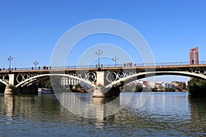 View of the Isabel II Bridge popularly called Puente de Triana in Seville, Spain.