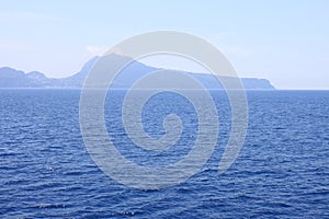 View of the island of Capri from the Tyrrhenian Sea in clear weather. Italy.