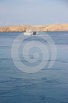 View of the island Rab, Croatia, and a car ferry.