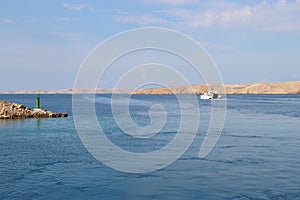 View of the island Rab, Croatia, lighthouse and car ferry.