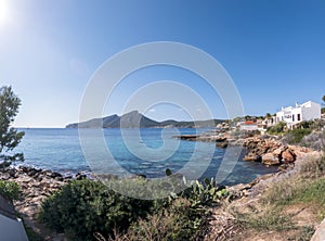 View on the island Sa dragonera covered with green forest surrounded by Mediterranean sea water, Mallorca, Balearic Islands, Spain