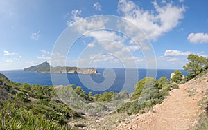 View on the island Sa dragonera covered with green forest surrounded by Mediterranean sea water, Mallorca, Balearic Islands, Spain