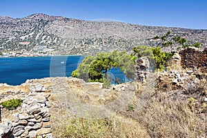 View of the island of Spinalonga with calm sea