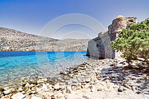 View of the island of Spinalonga with calm sea