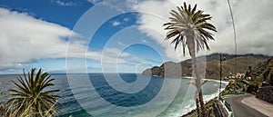 View of the island of Tenerife from Santa Catalina beach. Huge concrete piers for davit and the ruins of the old Hermigua port in