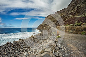 View of the island of Tenerife from Santa Catalina beach. Huge concrete piers for davit and the ruins of the old Hermigua port in