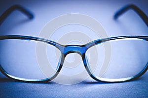 View on isolated blue eye glasses on blan background