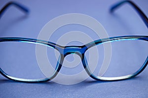 View on isolated blue eye glasses on blan background