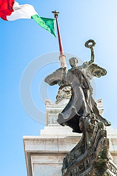 View of Italian national flag in front of Altare della Patria