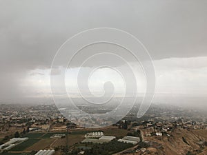 View of Jericho and Dead Sea from Mount of Temptation in Palestine during Rain in April.