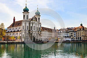 View of Jesuit church and the Reuss river in Lucerne, Switzerland