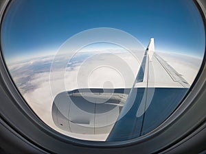 View from a Jet Airplane in flight, framed by the Window