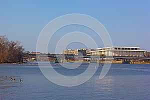 A view on John F. Kennedy Center for the Performing Arts in US capital from the Potomac River bank.