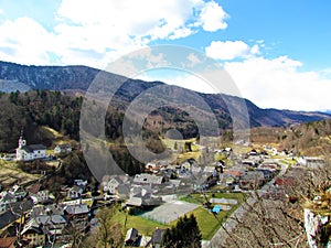 View of Kamna Gorica village under forest covered Jelovica in Gorenjska