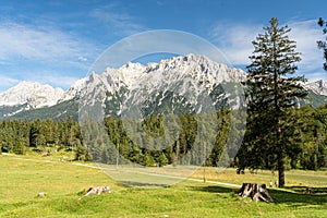 view on the karwendel mountains at the chapel of queen maria in Germany, Bayern-Bavaria, near the alpine town of Mittenwald photo