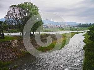 View of the Katsura River in Arashiyama Park Nakanoshima Area in Kyoto, Japan.