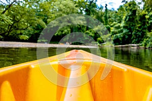 View from kayak towards mountain river rushing waters