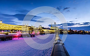 View of the Kazan Kremlin on the Kazanka River embankment at night in winter