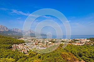View of Kemer town on coast of the Mediterranean sea in Antalya province, Turkey. Turkish Riviera. View from a mountain