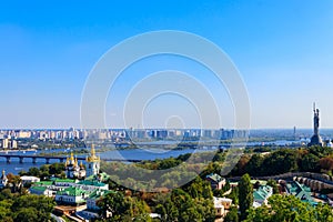 View of Kiev Pechersk Lavra (Kiev Monastery of the Caves), Motherland Monument and the Dnieper river in Ukraine.