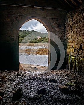 A View Of Kinlochaline Castle Across Loch Aline From The Boat House At The Head Of Loch Aline, Scotland. photo