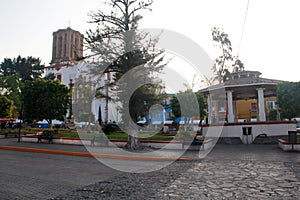 View of kiosk, central garden and parish in the town of Zimapan Hidalgo Mexico photo