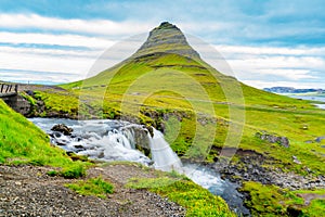 View of Kirkjufellsfoss and Kirkjufell mountain