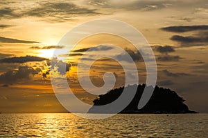 View of Koh Pu island at sunset from Kata Phuket beach, Thailand