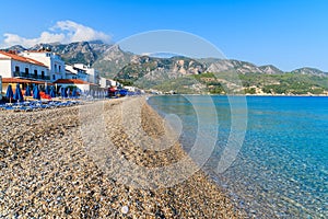 View of Kokkari beach and town houses in distance, Samos island, Greece