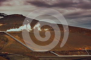 View of Krafla geothermal power plant, near Krafla Viti Volcano, Northeastern Iceland, in summer, with some grain