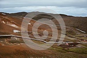 View of Krafla geothermal power plant, near Krafla Viti Volcano, Northeastern Iceland, in summer, with some grain