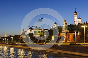 View of the Kremlin embankment, the towers of the Kremlin, the Grand Kremlin Palace, Ivan the Great Bell Tower in the late evening