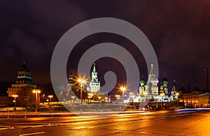 View of the Kremlin and St. Basil`s Cathedral from bridge the night