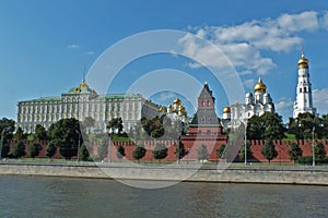 View of Kremlin wall with tower and Cathedral photo made from opposite bank of the river Moscow photo