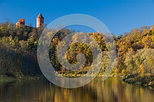 A view of krimulda castle and tower reflected in gauja river