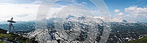 View from the Krippenstein mountain to the Dachstein mountain range. Panorama of high mountains with a permanent cover of ice.