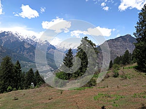 View of Kullu Valley and the mountains overlooking Manali town from camp site at Tilgan, Himachal Pradesh, India-