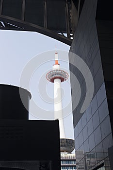 View of Kyoto tower from inside Kyoto central station on a sunny day