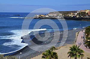 View on La Enramada pebble beach in Costa Adeje, Tenerife, Canary Islands, Spain. Playa La Enramada with volcanic sand. photo