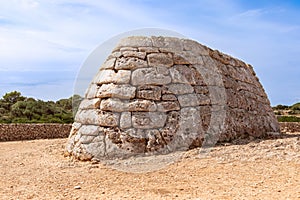 View of La Naveta des Tudons - the most famous of Menorcaâ€™s megalithic sites