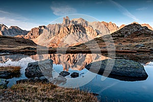 View of Lac Long with massif Des Cerces reflection on the lake in Claree valley at France