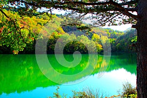 View at Lago di Boccafornace in Pievebovigliana, Valfornace (Macerata) with mirroring body of water photo