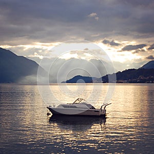 View of Lago di Como at the sunset. Aged photo.