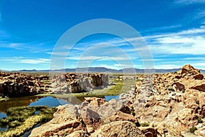 View of the Laguna Negra, Black lagoon Lake wedged between rock formations in Altiplano, Bolivia